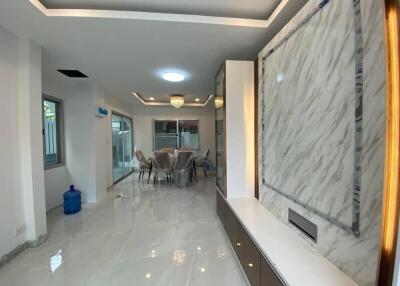 Modern dining room with marble accents and recessed lighting