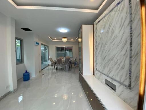 Modern dining room with marble accents and recessed lighting