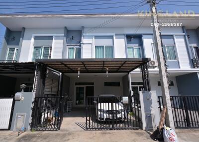 Two-story townhouse with covered carport