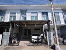 Two-story townhouse with covered carport