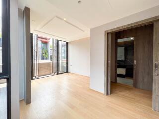 Spacious living room with large windows and modern sliding doors