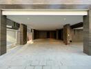 Spacious covered garage with tiled walls and floors