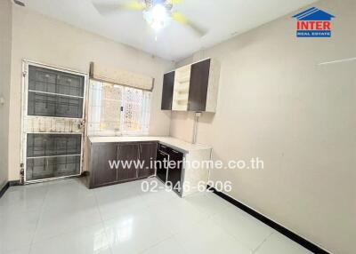 Unfurnished kitchen with storage cabinets