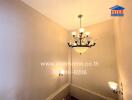 Interior view of a stairwell with chandelier lighting