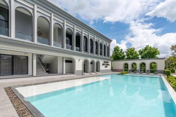 Exterior view of a building with a swimming pool