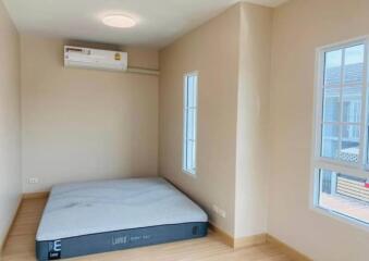 Bedroom with air conditioning and mattress