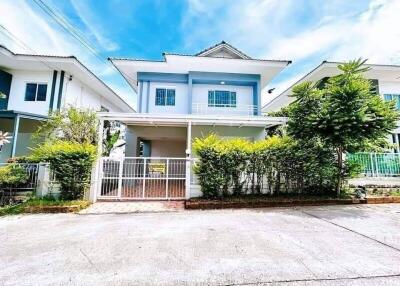 Two-story house with front yard and driveway