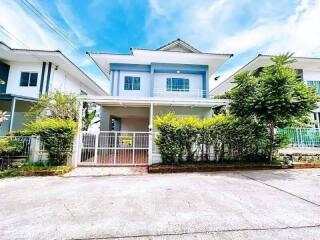 Two-story house with front yard and driveway