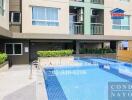 Condominium building with outdoor swimming pool