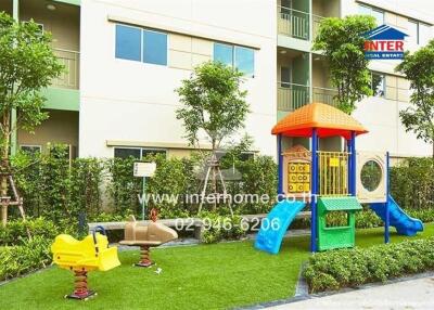 Outdoor play area with colorful playground equipment in a residential complex