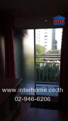 Living room with sliding glass door leading to balcony