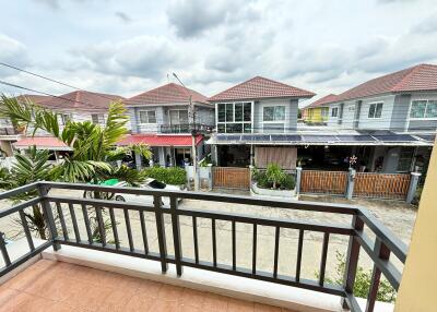 View from balcony showing neighborhood houses