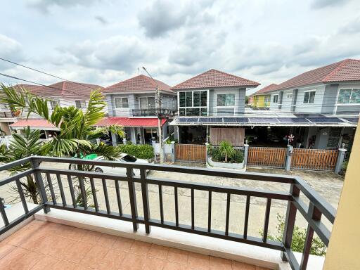 View from balcony showing neighborhood houses