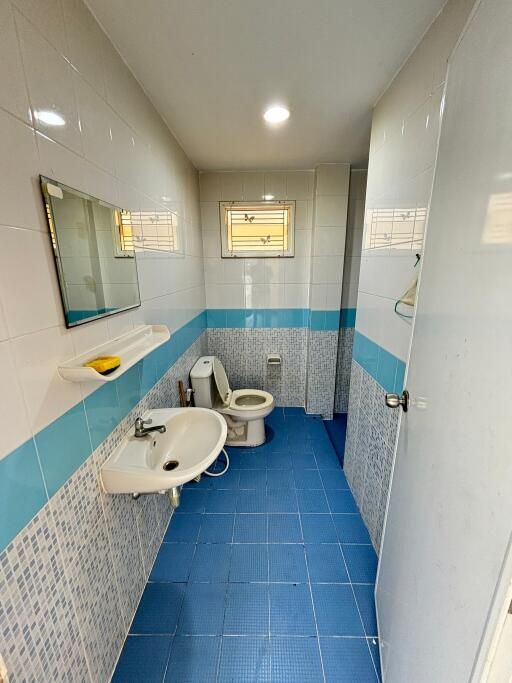 modern bathroom with blue tiled floor