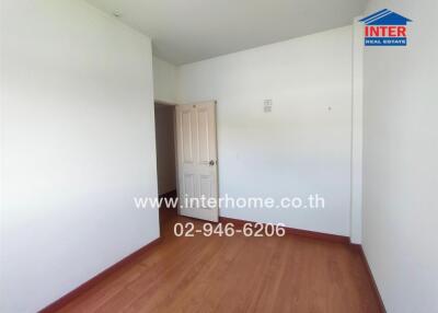 Empty bedroom with wooden floor