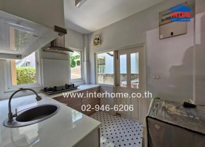 Modern kitchen with appliances and natural light