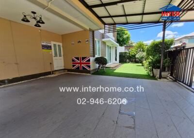 Covered outdoor patio area with garden view