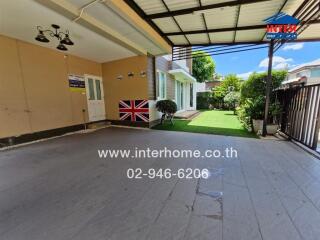 Covered outdoor patio area with garden view