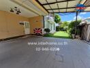 Covered outdoor patio area with garden view