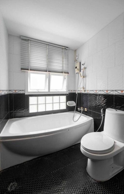 Bathroom with bathtub and toilet