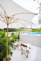 Outdoor area with pool and seating