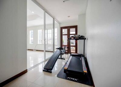 Fitness area with treadmill and exercise equipment