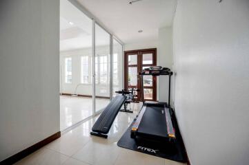 Fitness area with treadmill and exercise equipment