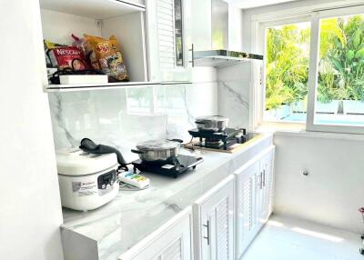 Modern kitchen with appliances and a window view