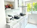 Modern kitchen with appliances and a window view