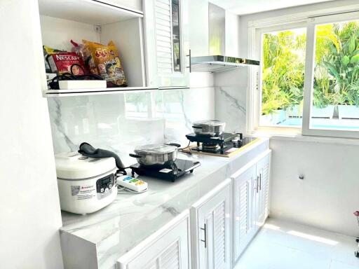 Modern kitchen with appliances and a window view