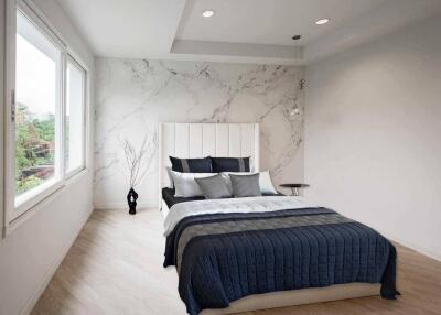 Modern bedroom with a large window, stylish decor, and a comfortable bed