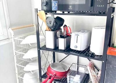 Organized kitchen storage with appliances and utensils