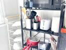 Organized kitchen storage with appliances and utensils