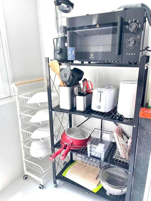 Organized kitchen storage with appliances and utensils