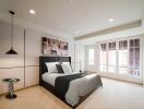 Modern bedroom with large windows and natural light