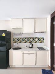 Modern kitchen with tiled backsplash and appliances