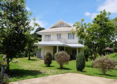 Two-story house with a garden