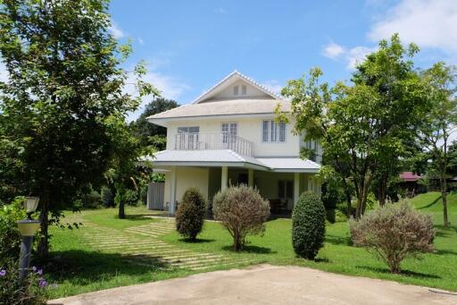 Two-story house with a garden