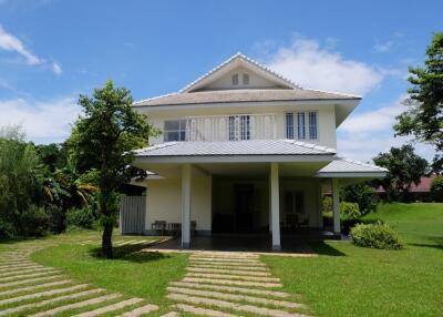 Exterior of a modern two-story house with large front yard