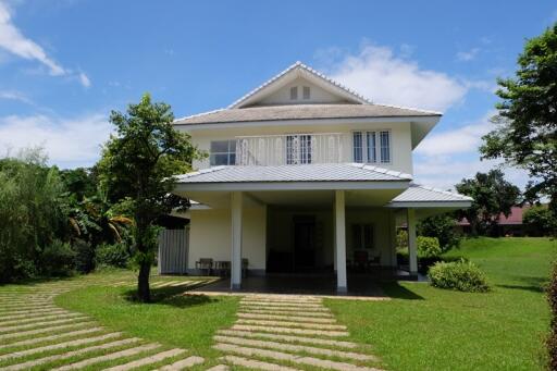 Exterior of a modern two-story house with large front yard