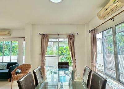 Bright dining area with glass table