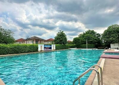 outdoor swimming pool with cloudy sky