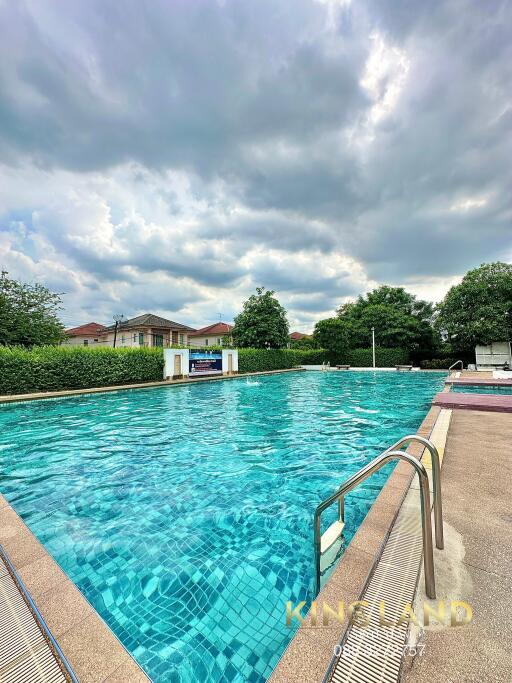 outdoor swimming pool with cloudy sky