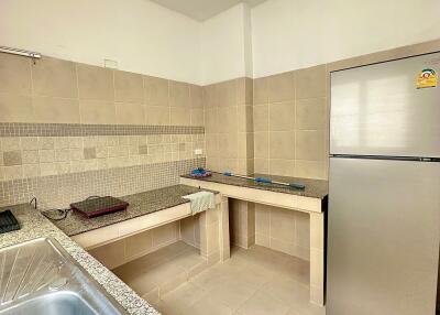 Modern kitchen with tiled backsplash and stainless steel appliances