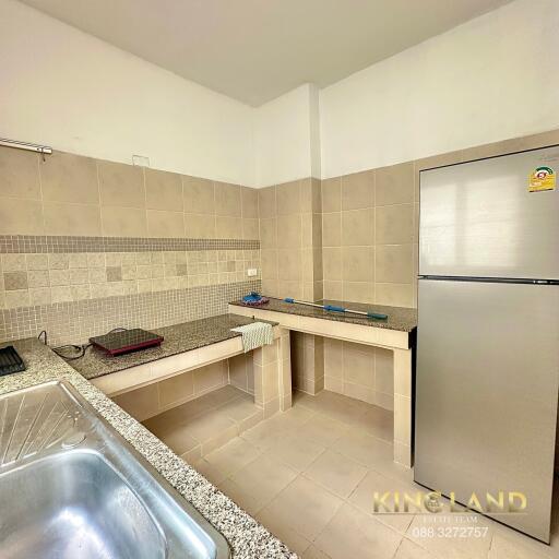 Modern kitchen with tiled backsplash and stainless steel appliances