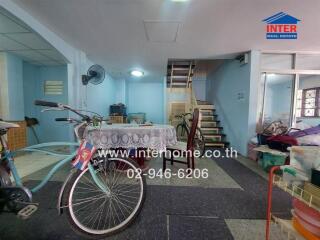 Modest living space with bicycles and stairs