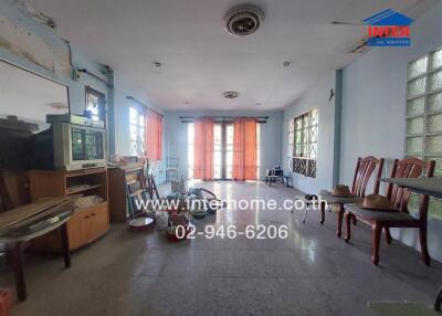 Living room with furniture and large windows