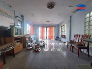 Living room with furniture and large windows