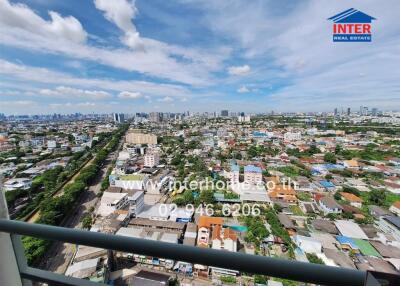 Panoramic city view from a high-rise balcony