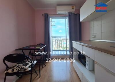 Compact kitchen with table and chairs, window view